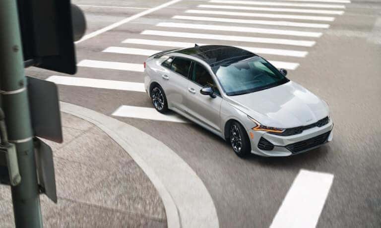2026 Kia K5 turning corner in town