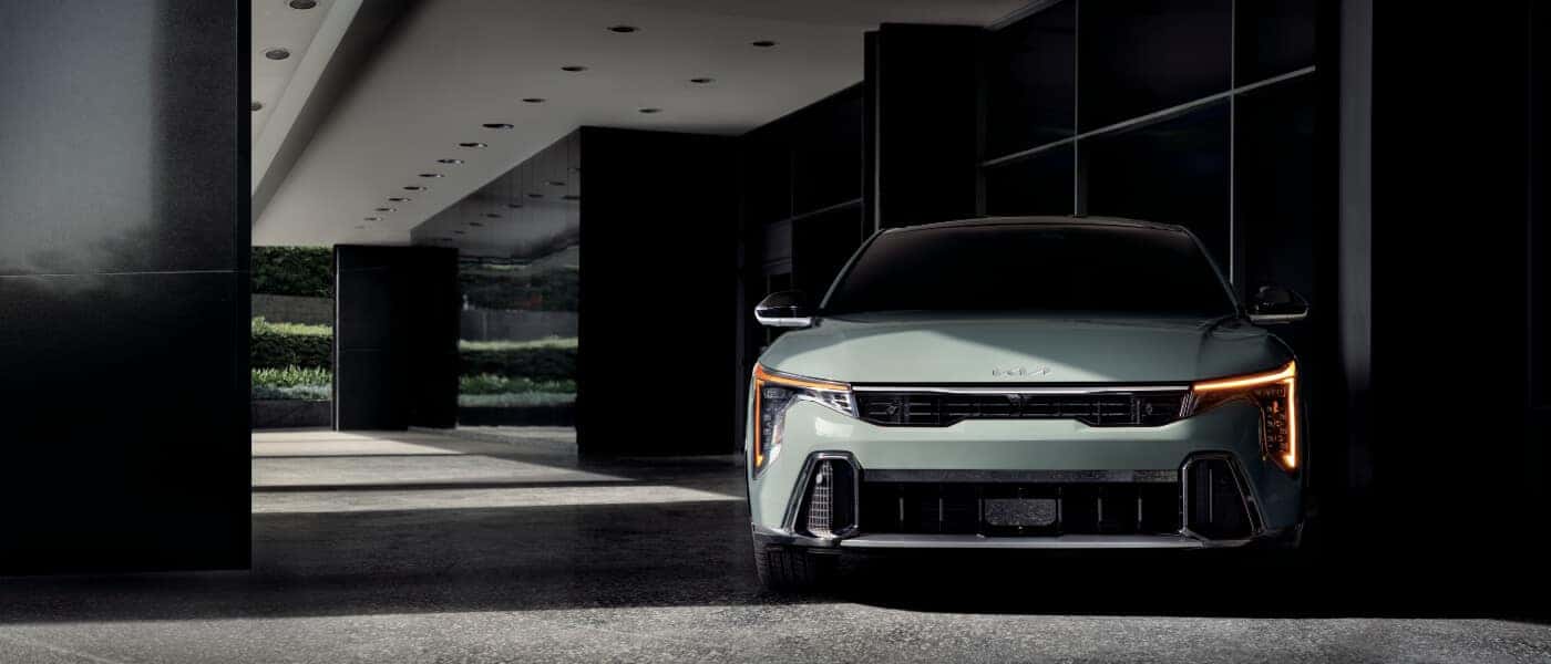 2026 Kia K4 parked head-on by building
