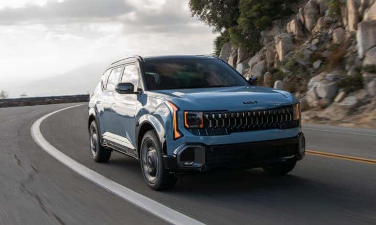 2027 Kia Seltos driving on a curve