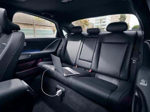 2024 IONIQ 6 view of back seating area with laptop charging via charging outlet