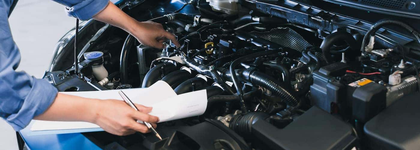 mechanic doing battery inspection