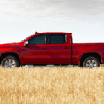 2020 chevrolet silverado 1500 red exterior side parked in field