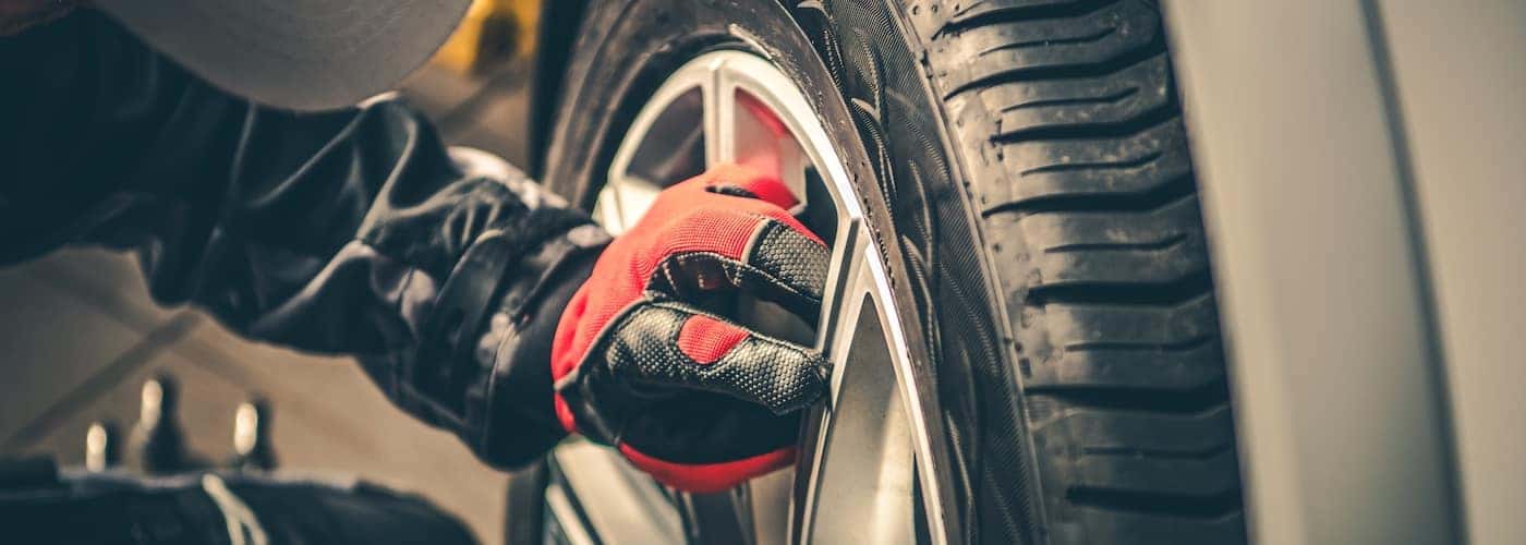 mechanic rotating tires