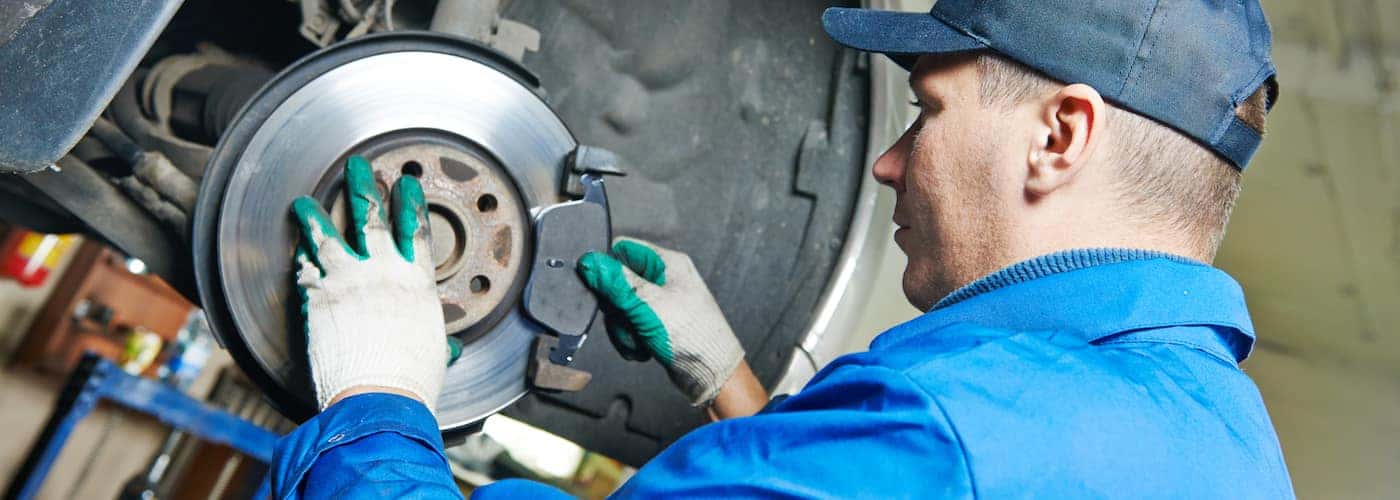 mechanic checking brake components