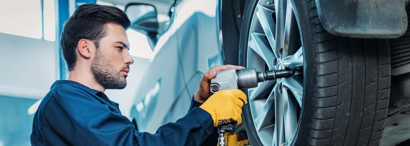 mechanic working on tires close up