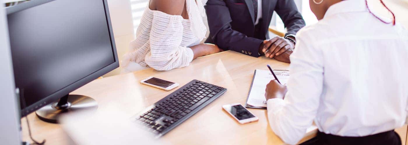 couple signing loan papers