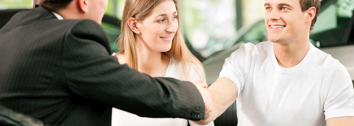 finance manager shaking client hands