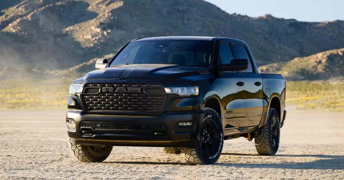 2026 RAM 1500 pickup truck parked in a vast, sandy desert