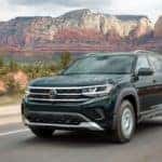 Atlas SUV on road in front of mountains