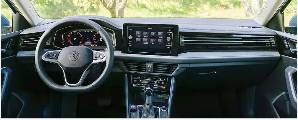 Dashboard and front interior cockpit of a 2026 Volkswagen Jetta featuring a central touchscreen display.