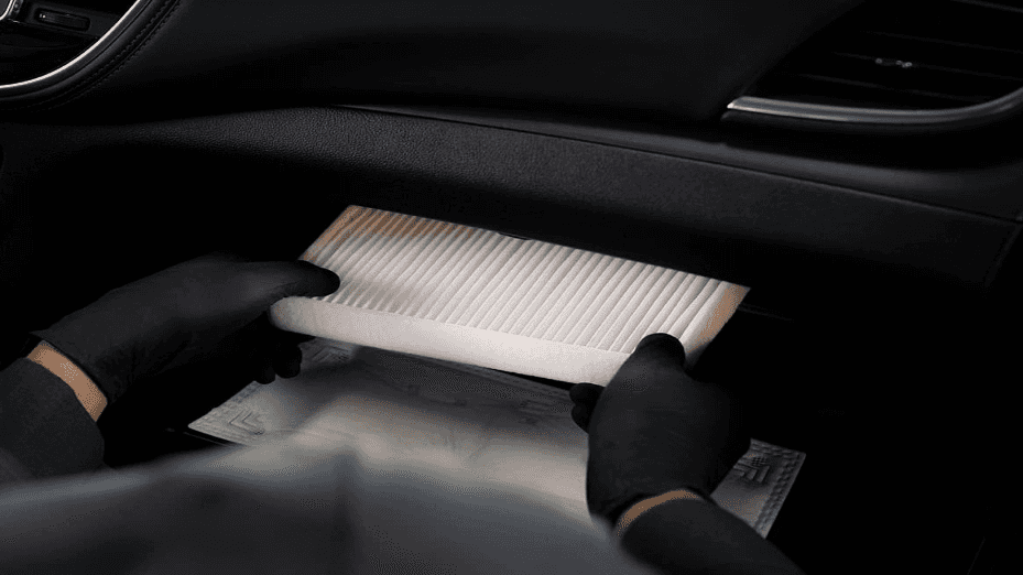 A cabin air filter being installed