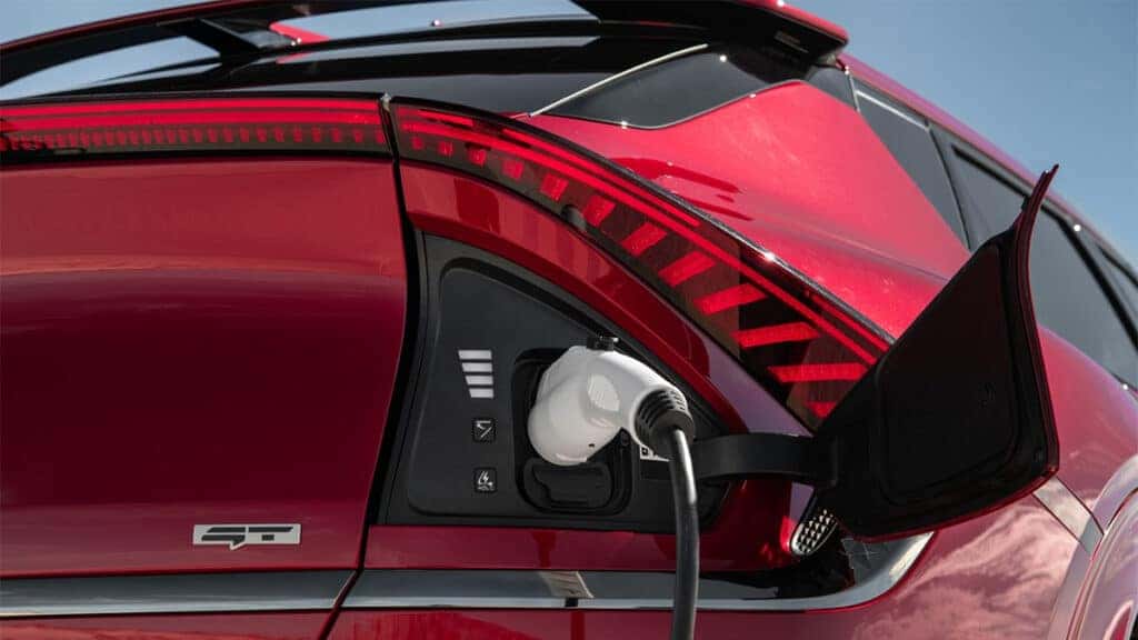 Kia EV6 charging port with cable plugged in