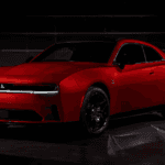 2024 Dodge Charger Daytona EV in the dark with it's lights illuminating