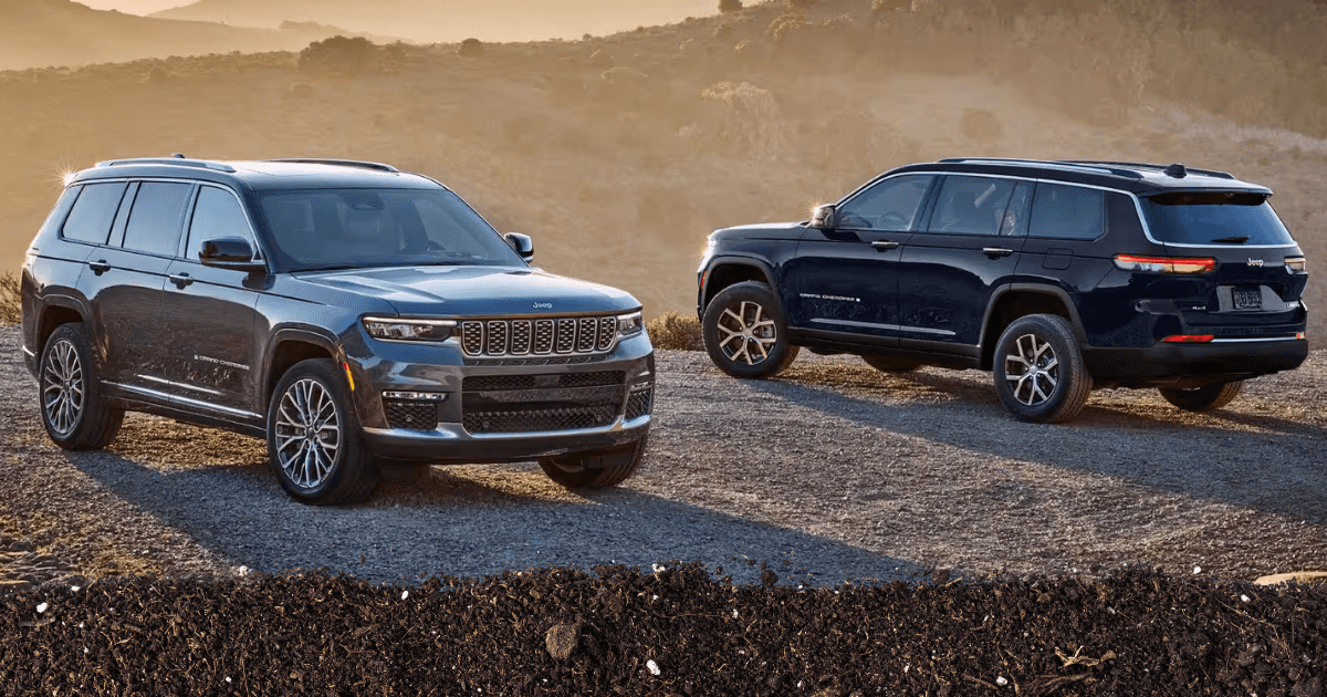 The 2025 Jeep grand Cherokee on a ridge with hazy mountains in the background