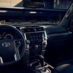 View_of_the_steering_wheel_the_infotainment_system_and_side_view_mirror_of_the_2022_Toyota_4Runner_o