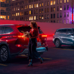 Highlanders parked on rooftop garage at night